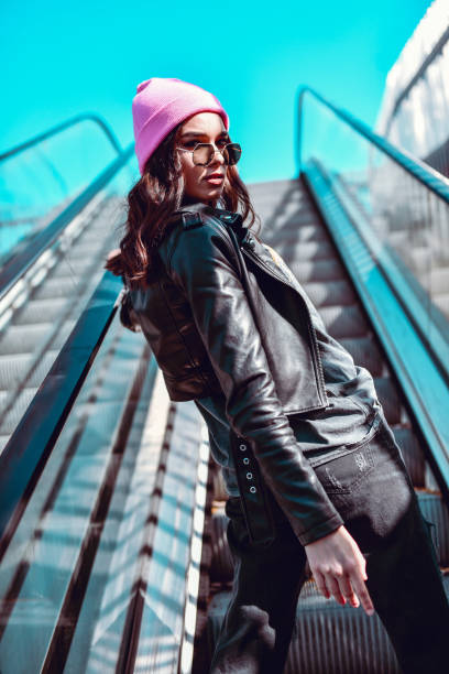 Cute Female Riding On Escalator Stairs While Enjoying The Sun