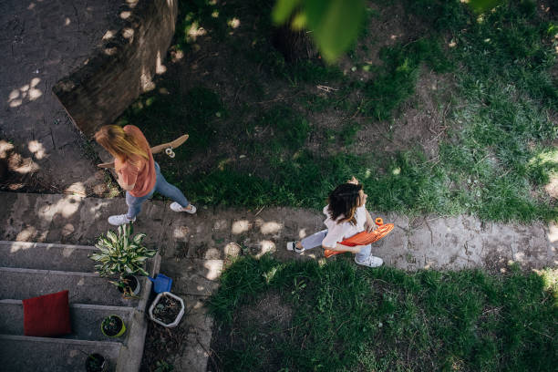 istock Friends hanging out in park 1397016634