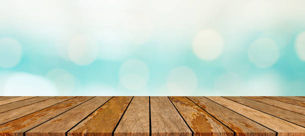 istock blurred natural blue sea gradient glow backdrop wall with retro brown wood texture panel color background table top for advertise,show,promote products on display 1397016926