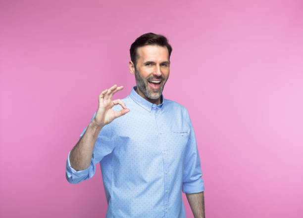 istock Happy mid adult man gesturing OK sign 1397017106