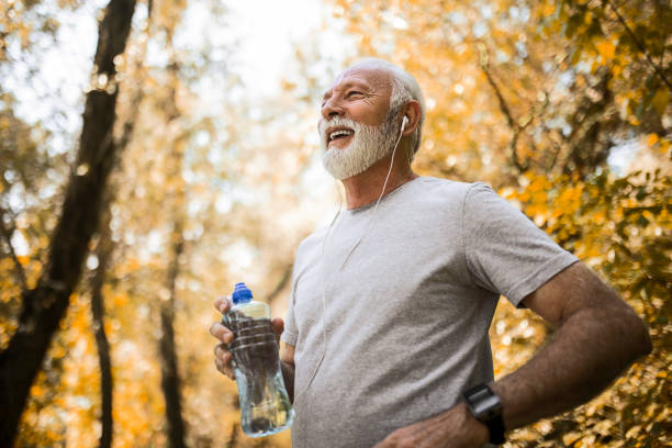 istock Senior man hydrating after exercise in park 1397017878
