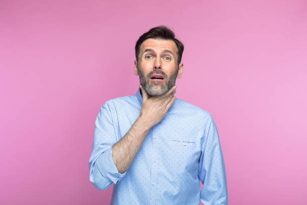 istock Man suffering with throat pain 1397017944