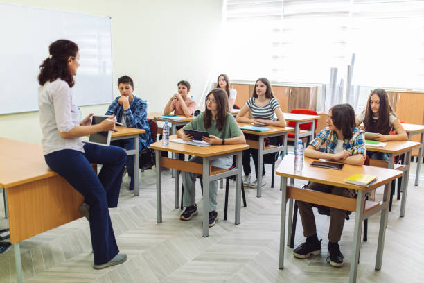 istock High school students on class in school listening their teacher 1397018063