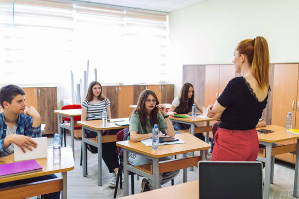 istock High school students on class in school listening their teacher 1397018322