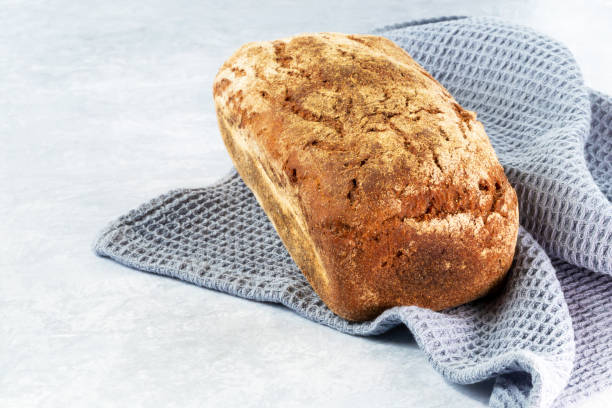 istock Freshly baked dark bread on a napkin 1397018557