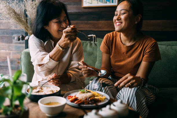 istock Mother And Daughter Eating Lunch Together 1397018620