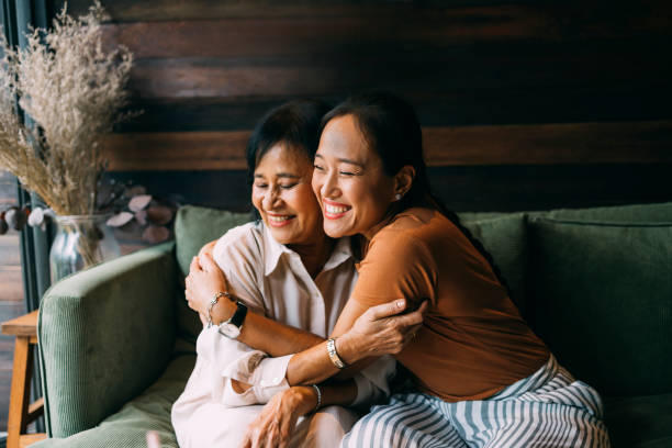 Mother And Daughter Hugging Each Other stock photo
