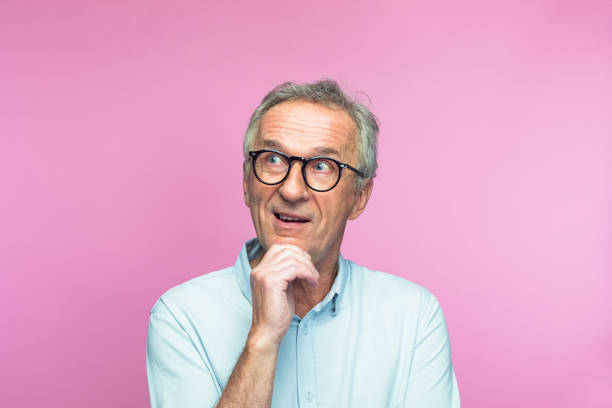 istock Happy contemplative senior man looking away 1397019283