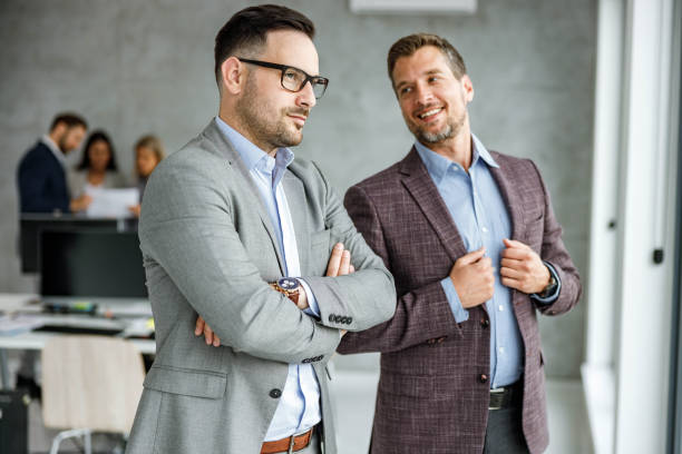 istock Male colleagues working at corporate office. 1397019462