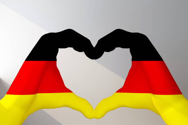 istock hands in heart gesture painted in flag Germany 1397019685