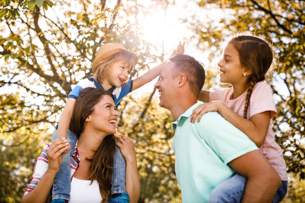 istock Carefree parents and their small kids having fun in springtime. 1397019883