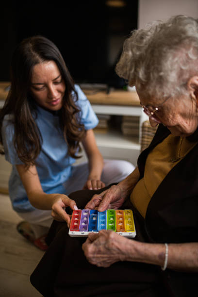 istock Beautiful young nurse explaining new medication to her senior patient 1397020694