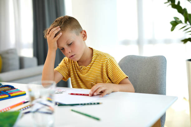 istock Young boy doing his homework. Back to school. Online class from home. 1397020889