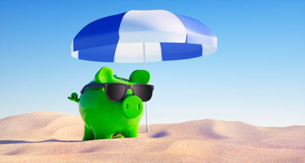 istock Piggy bank at empty beach background 1397021162