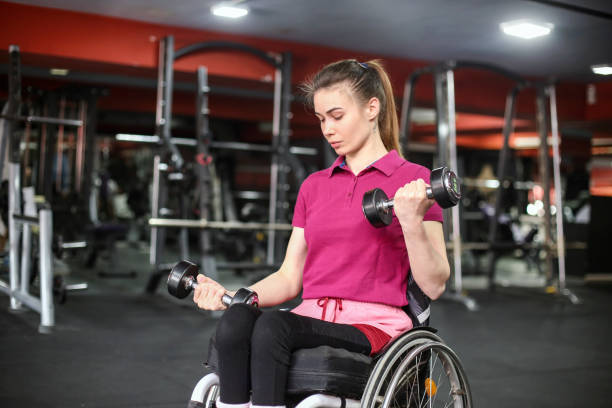 istock Disabled young woman exercising in a gym 1397022077