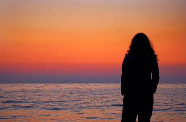 istock Woman at sunrise 139702417