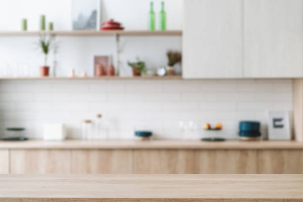 istock Empty hardwood countertop against blur kitchen interior 1397025316