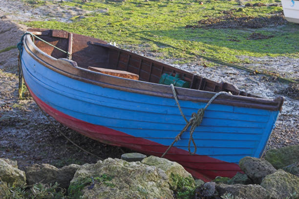 istock Blue & red rowing boat on land 139702585