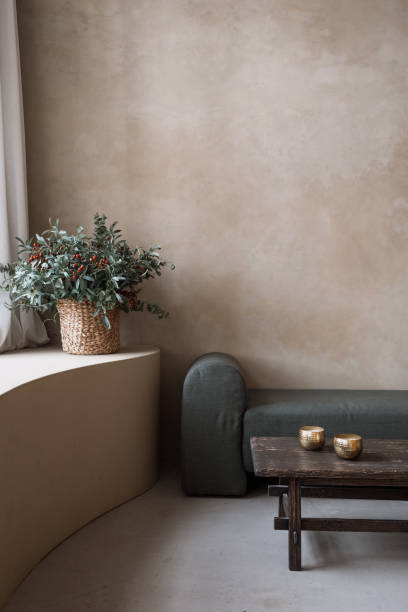 istock Modern soft couch, bronze bowls and decorative flowers 1397026034