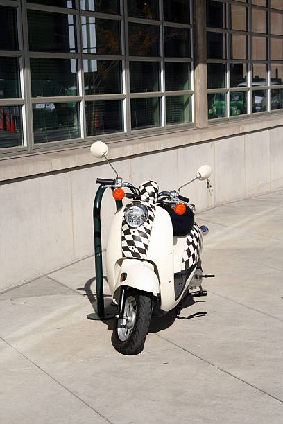 Scooter on city sidewalk. stock photo