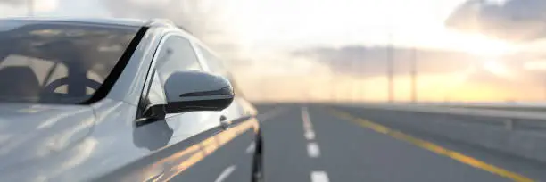 Generic white car travelling along the open road at sunrise 3d render