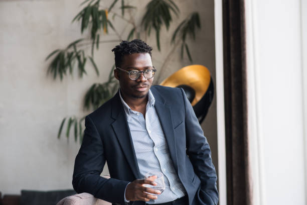 istock Young black businessman waiting in a lobby 1397028856