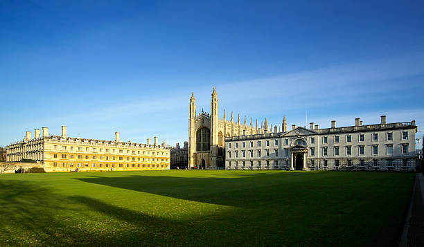 Old Cambridge college buildings Old Cambridge college buildings in great winter sunshine, blue sky, viewed from near the river Cam, with a scattering of distant unidentifiable tourists.  Perspective corrected. cambridgeshire photos stock pictures, royalty-free photos & images