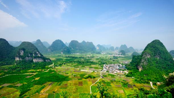 istock Karst peaks and farmland in springtime 1397029802
