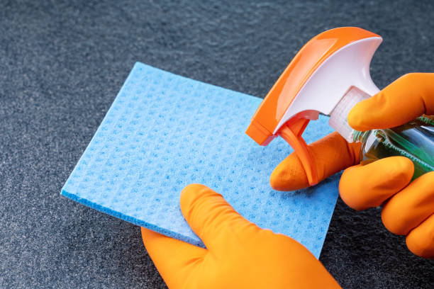 istock Female hands cleaning on title surface. Cleaning concept. 1397029924