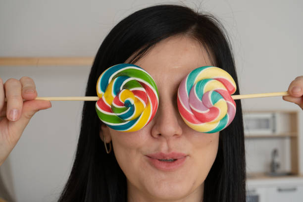 istock woman with two lollipops 1397030026