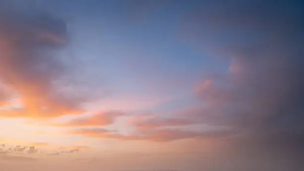 Photo of Colorful pastel sky with clouds at beautiful sunset as natural background.