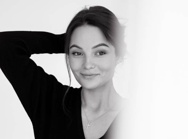 istock View through transparent curtains to young smiling woman. 1397032319