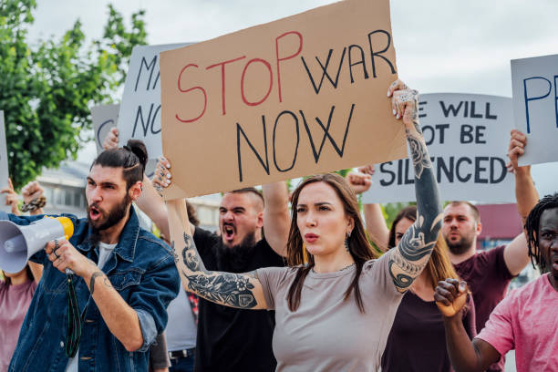 istock Young protesters on the street 1397032513
