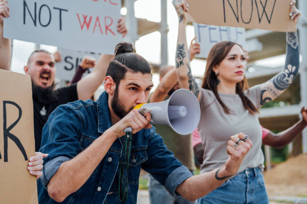 istock Young man during a demonstration in the street 1397032603