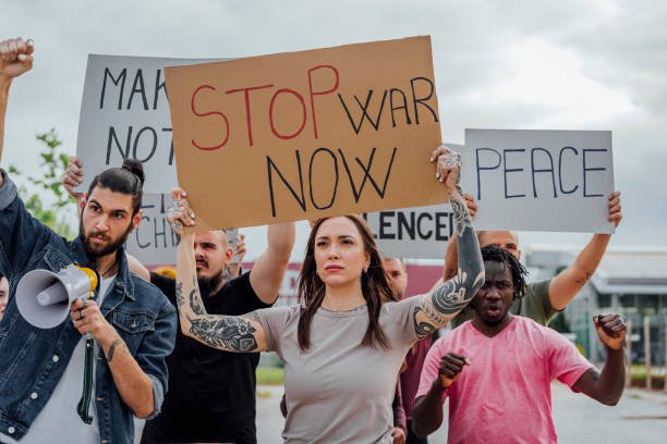 istock Young protesters on the street 1397032633