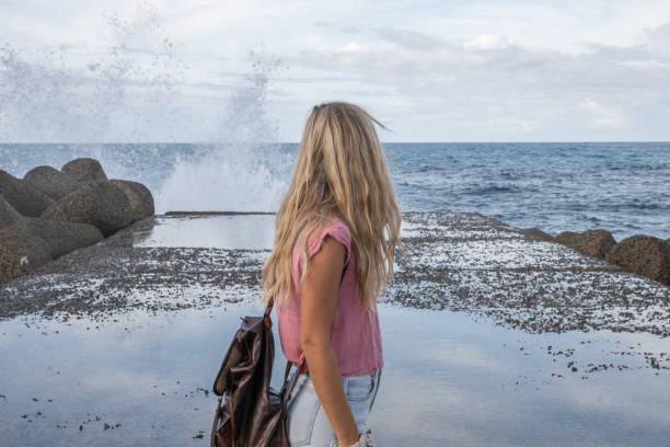 She enjoys Sardinia in autumn, being alone in solitude watching nature. Waves slashing on the coast