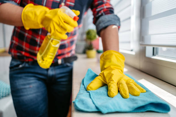 istock Young Man Cleaning The Window Sill Surface 1397033956