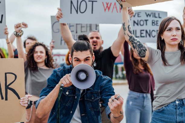 istock Young man during a demonstration in the street 1397034034