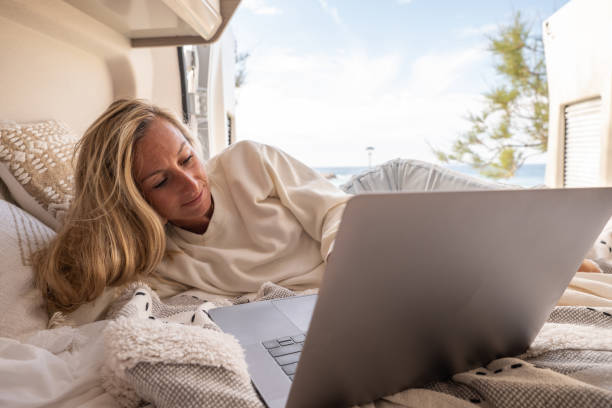 istock Woman working online from her Campervan 1397034155