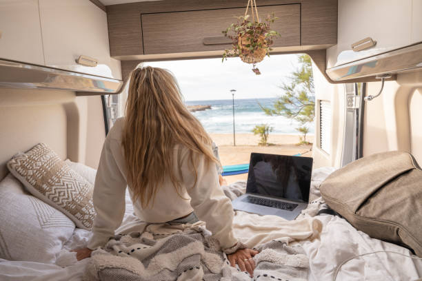 istock Woman working online from her Campervan 1397034288
