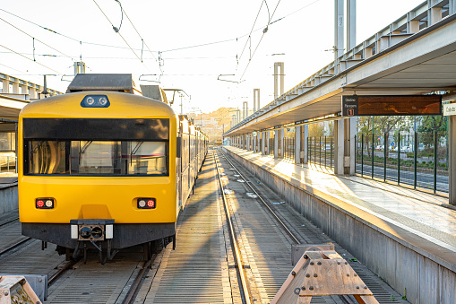 Train public transport electric yellow passengers on railway station
