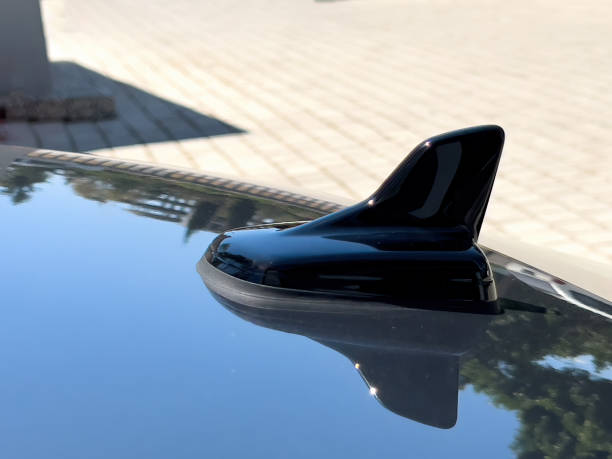 istock Shark antenna on black luxury car on sunny day 1397035343