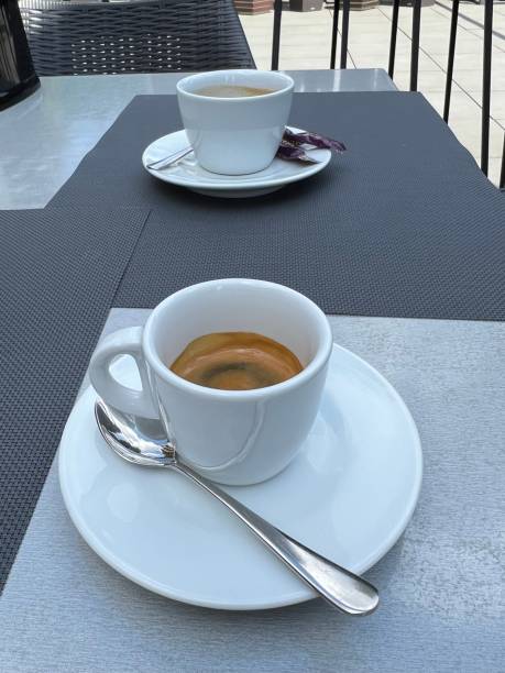 istock White cup of coffee on a table outdoor 1397036560