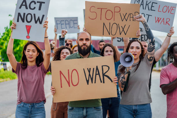 istock Protesters with signs during a demonstration in the street 1397037484