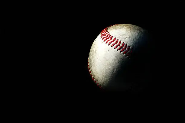 Baseball lighting, in darkness, in shadows, backround, red seams, good contrast