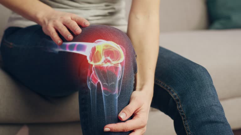 VFX Joint and Knee Pain Augmented Reality Animation. Close Up of a Person Experiencing Discomfort in a Result of Leg Trauma or Arthritis. Massaging the Muscles to Ease the Injury.