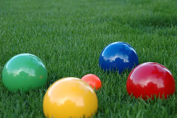 Boccie balls in the grass
