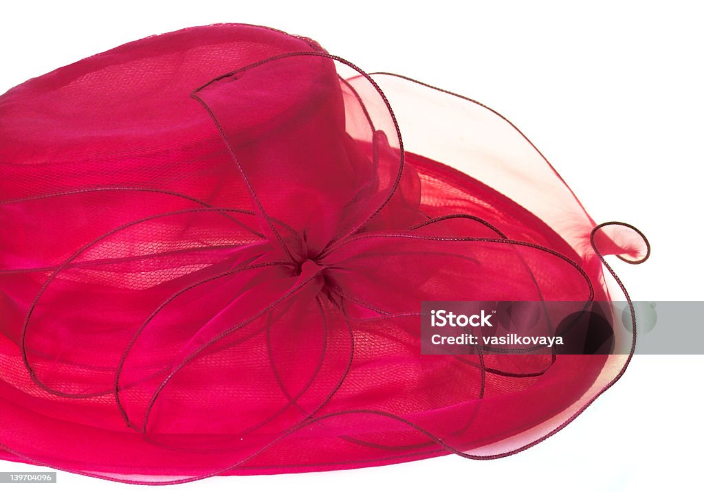 Red eloquent ladies hat with a big matching ribbon flower  red hat on the white background Adult Stock Photo