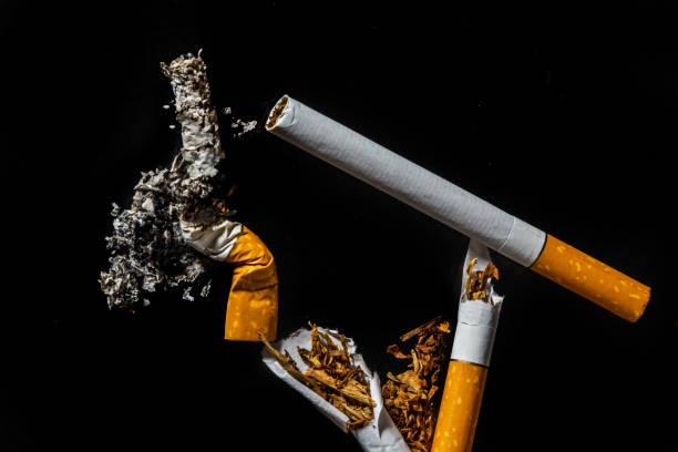 istock Cigarette smoking closeup isolated on balck background. No smoking concept 1397041539