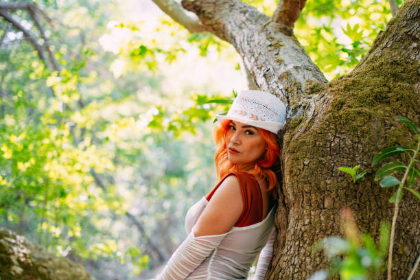 Beautiful Redhead Woman in the Untouched Forest and River